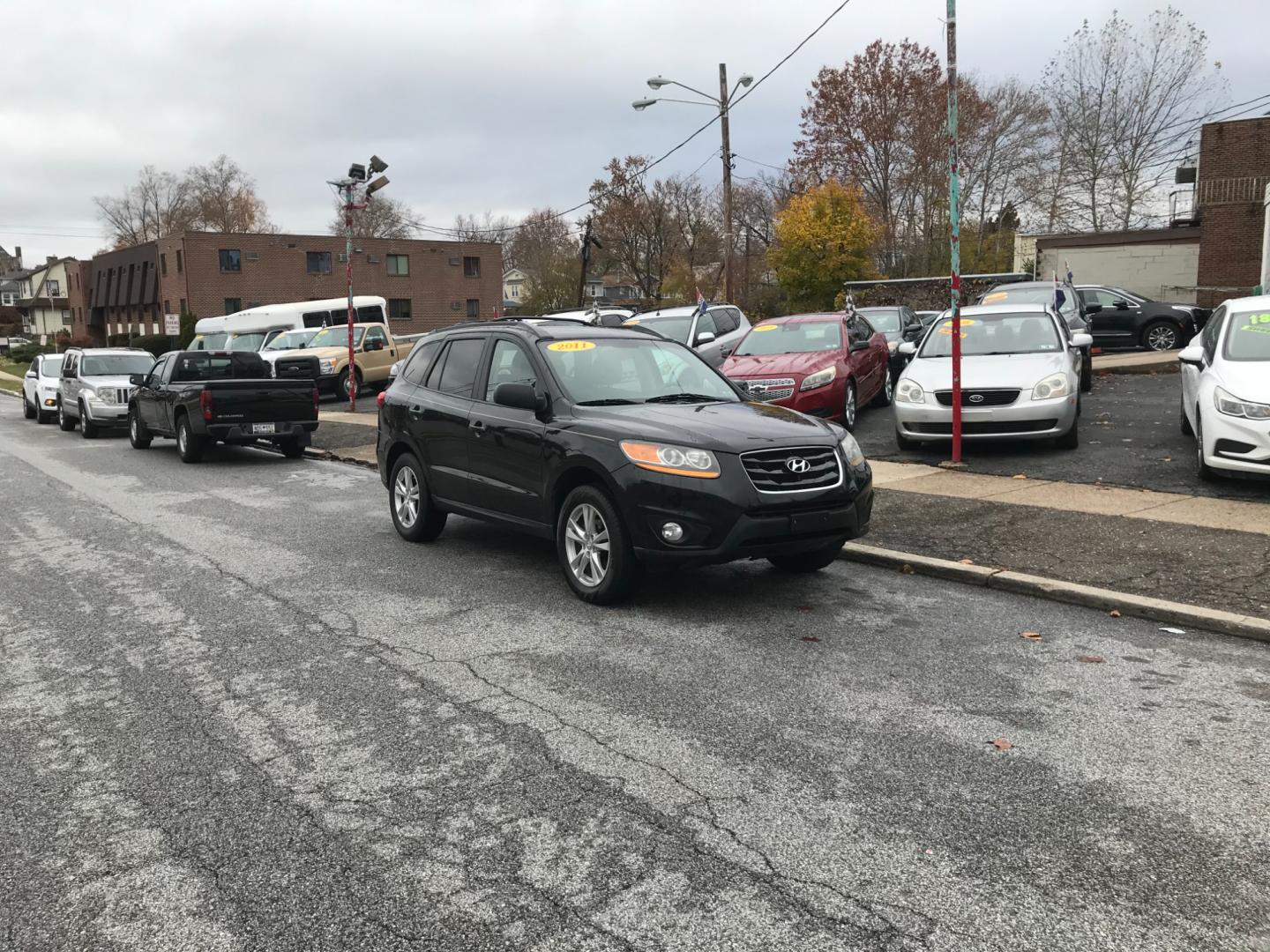 2011 Black /Gray Hyundai Santa Fe (5XYZHDAG2BG) with an 3.5 V6 engine, Automatic transmission, located at 577 Chester Pike, Prospect Park, PA, 19076, (610) 237-1015, 39.886154, -75.302338 - Photo#1